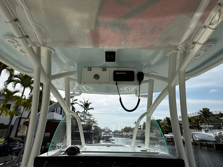 Yacht Photos Pics 2022 Sailfish 290 CC boat interior view with electronics and canopy.