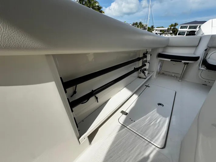 Yacht Photos Pics 2022 Sailfish 290 CC boat interior with rod storage and seating.
