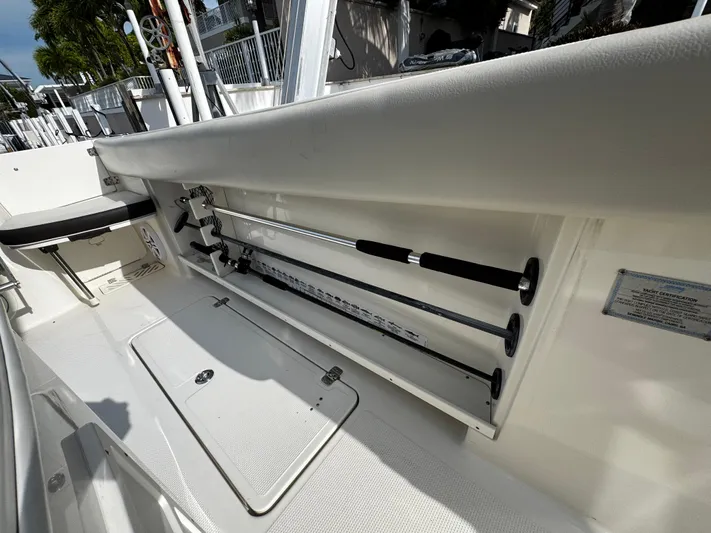  Yacht Photos Pics 2022 Sailfish 290 CC boat interior with rod storage compartment.