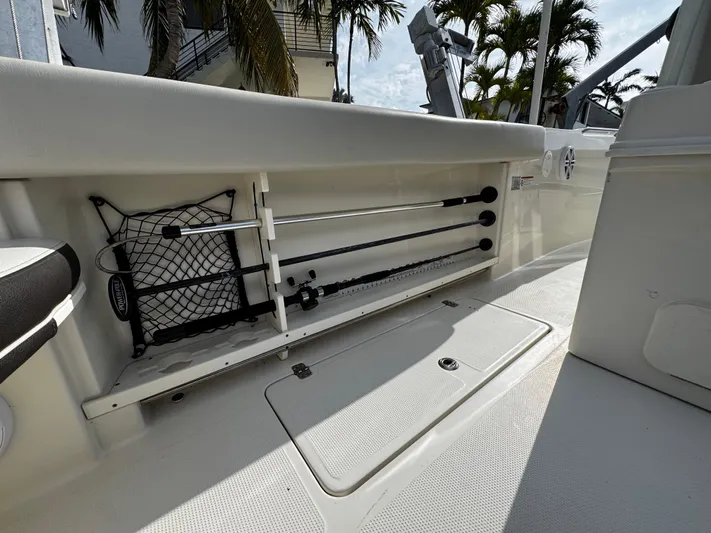  Yacht Photos Pics Interior view of a 2022 Sailfish 290 CC boat, showcasing storage compartments.