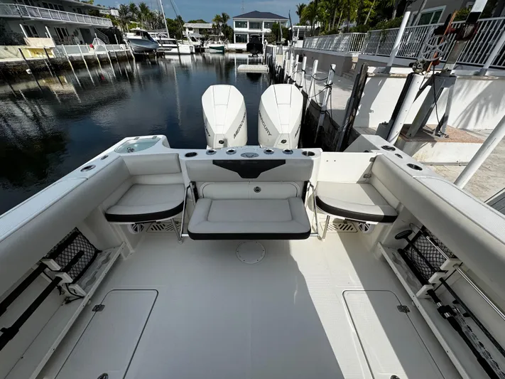  Yacht Photos Pics 2022 Sailfish 290 CC boat interior with dual engines docked at marina.