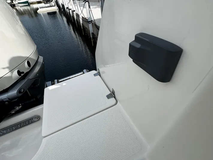  Yacht Photos Pics Sailfish 290 CC 2022 boat deck detail near water dock.