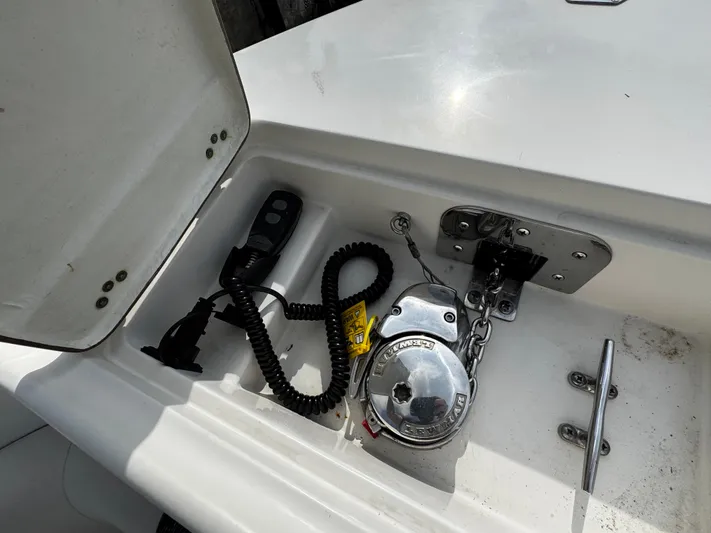  Yacht Photos Pics Anchor compartment of 2022 Sailfish 290 CC boat with winch and remote control.