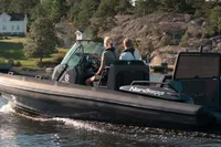 Nordkapp AIRBORNE 8 boat cruising on a scenic lake, 2023 model.