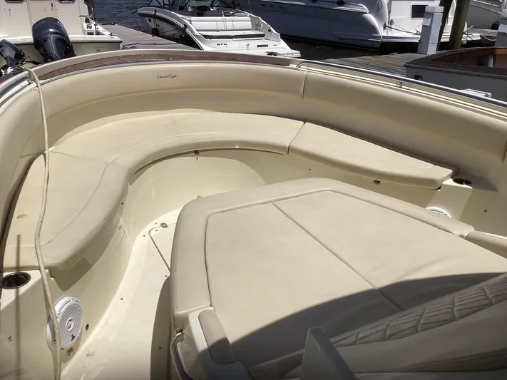  Yacht Photos Pics 2016 Chris-Craft 34 Catalina boat interior with beige seating at a marina.
