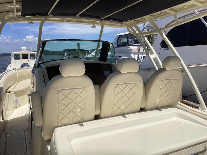  Yacht Photos Pics 2016 Chris-Craft 34 Catalina boat interior with beige leather seats.