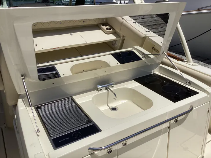  Yacht Photos Pics 2016 Chris-Craft 34 Catalina boat galley with sink, stove, and storage.