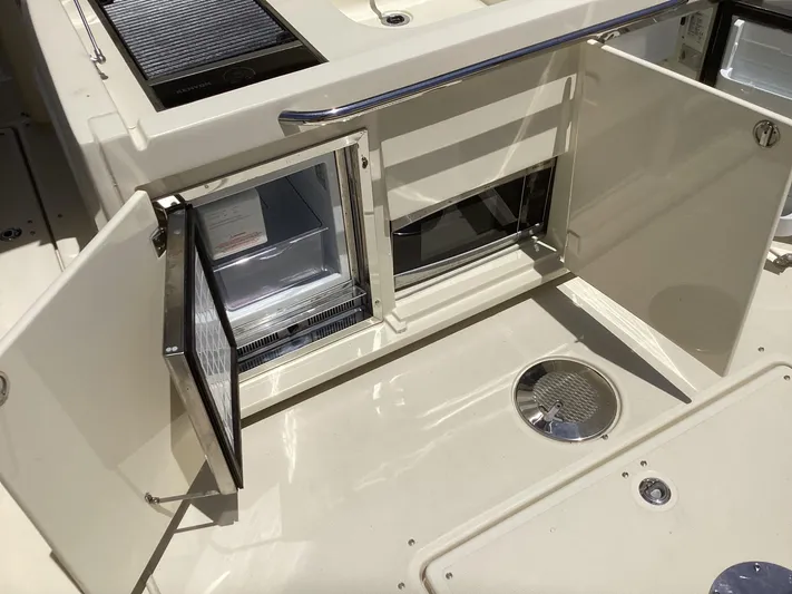  Yacht Photos Pics 2016 Chris-Craft 34 Catalina boat interior with open storage compartments.