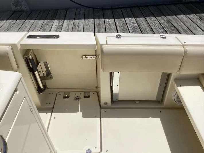  Yacht Photos Pics 2016 Chris-Craft 34 Catalina boat interior with beige seating and storage compartments.