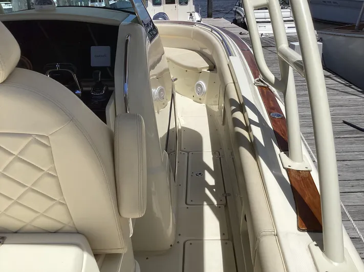  Yacht Photos Pics 2016 Chris-Craft 34 Catalina boat interior with beige seating and wood accents.