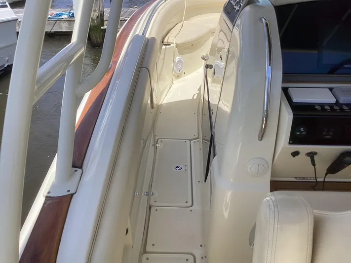  Yacht Photos Pics 2016 Chris-Craft 34 Catalina boat deck with white seating and control panel.