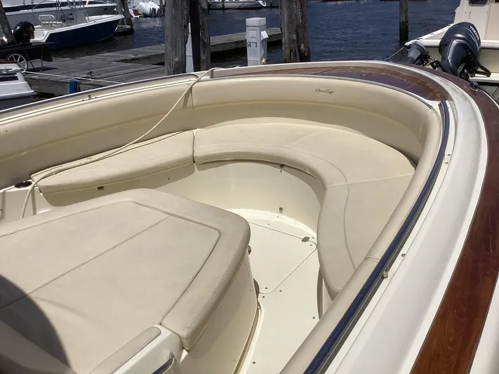  Yacht Photos Pics 2016 Chris-Craft 34 Catalina boat with spacious seating at the bow, docked at a marina.
