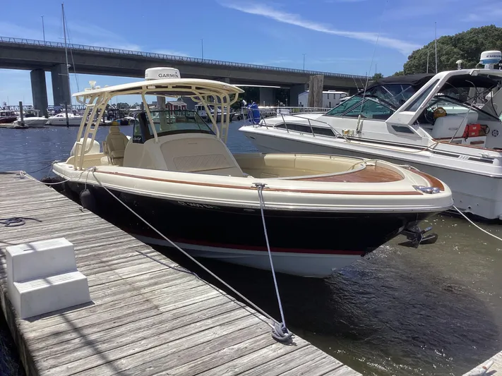 Yacht Photos Pics 2016 Chris-Craft 34 Catalina docked at a marina on a sunny day.