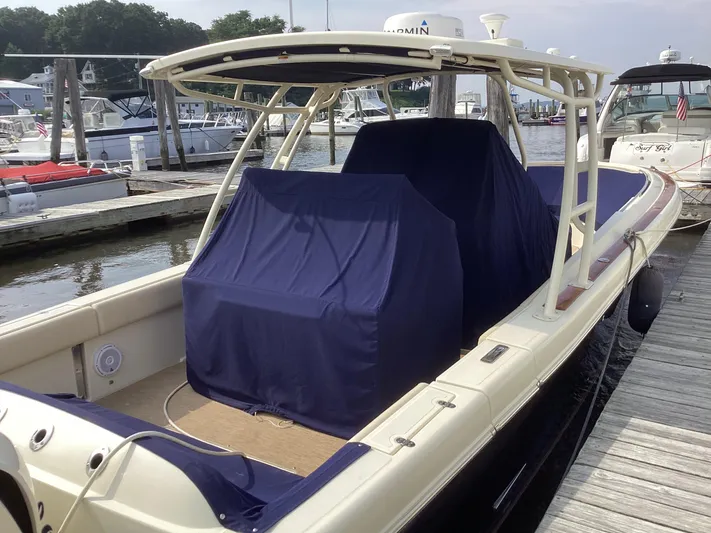  Yacht Photos Pics 2016 Chris-Craft 34 Catalina boat docked, covered with blue canvas.