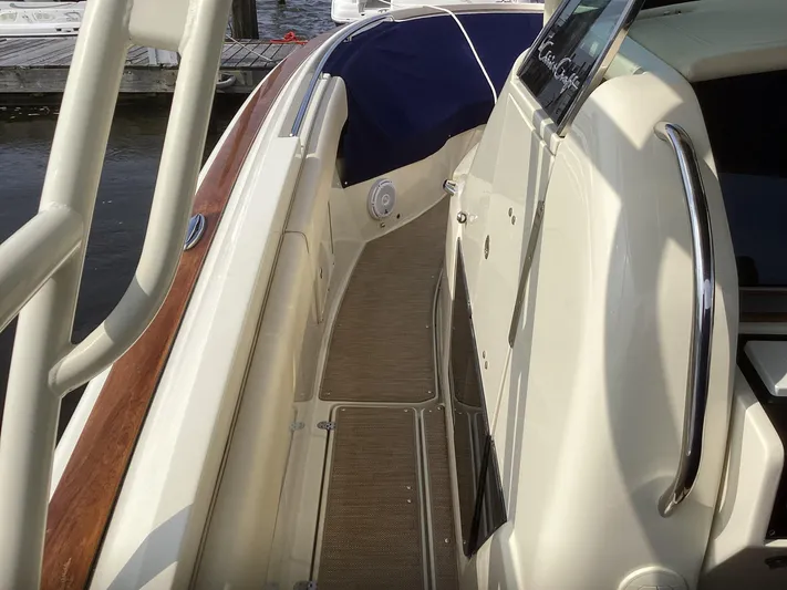  Yacht Photos Pics 2016 Chris-Craft 34 Catalina boat deck with wood accents and stainless steel railings.