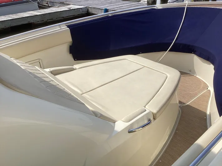  Yacht Photos Pics 2016 Chris-Craft 34 Catalina boat interior with cushioned seating and blue trim.