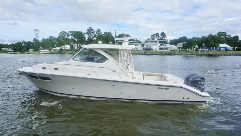 Yacht Photos Pics 2018 Pursuit OS 355 Offshore boat cruising on a calm river.