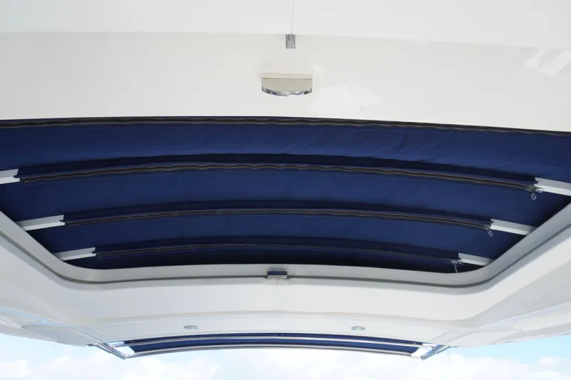  Yacht Photos Pics 2020 Sea Ray SLX 310 Outboard boat canopy, featuring blue retractable sunshade.