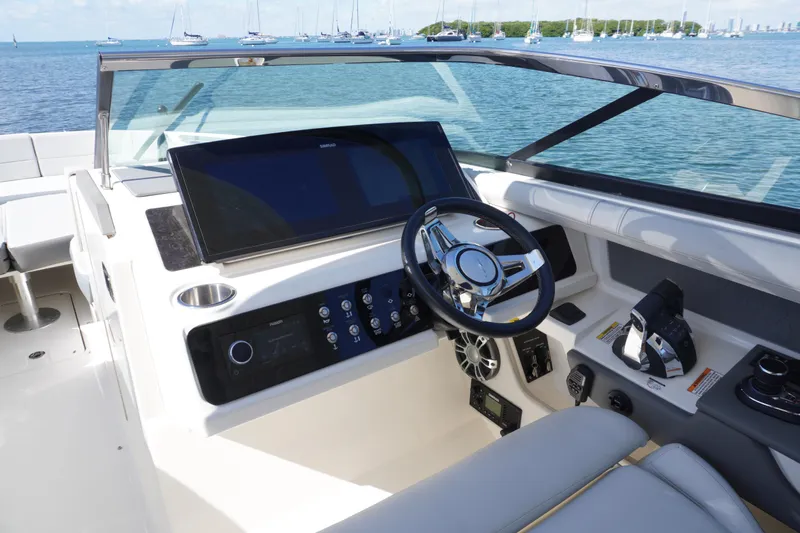  Yacht Photos Pics 2020 Sea Ray SLX 310 Outboard helm with modern controls and scenic ocean view.