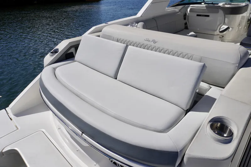  Yacht Photos Pics Luxurious seating on 2020 Sea Ray SLX 310 Outboard boat, featuring elegant design and comfort.