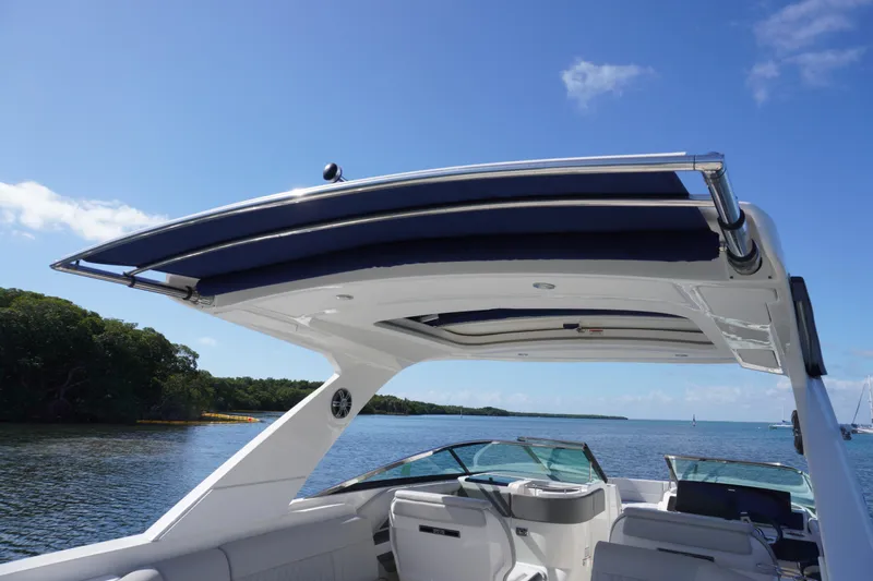 Yacht Photos Pics 2020 Sea Ray SLX 310 Outboard boat with sleek canopy on a sunny day.
