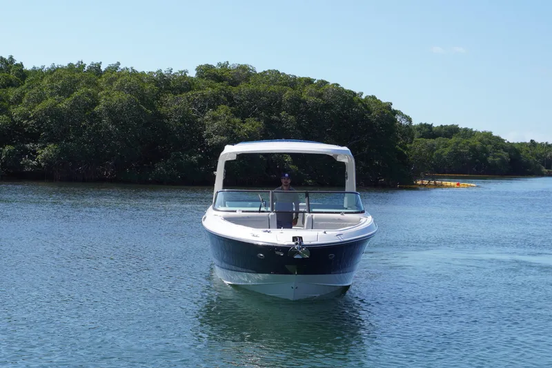  Yacht Photos Pics 2020 Sea Ray SLX 310 Outboard boat cruising on a serene lake.