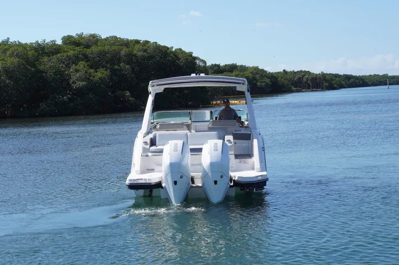  Yacht Photos Pics 2020 Sea Ray SLX 310 Outboard cruising on a serene waterway.