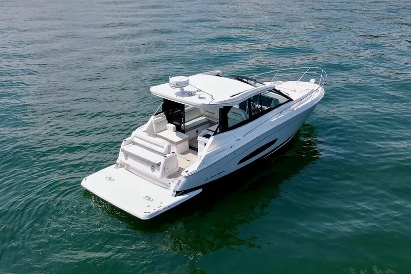  Yacht Photos Pics 2021 Regal 36 Grande Coupe boat on calm water, rear view.