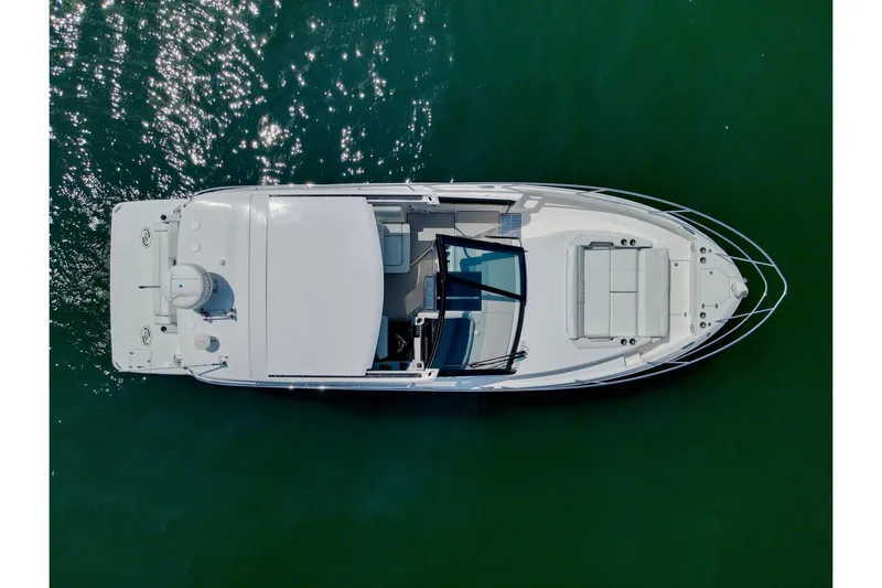  Yacht Photos Pics Top view of a 2021 Regal 36 Grande Coupe boat on water.