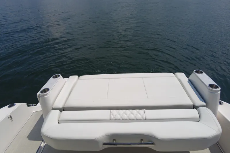  Yacht Photos Pics 2021 Regal 36 Grande Coupe boat with luxurious white seating overlooking water.