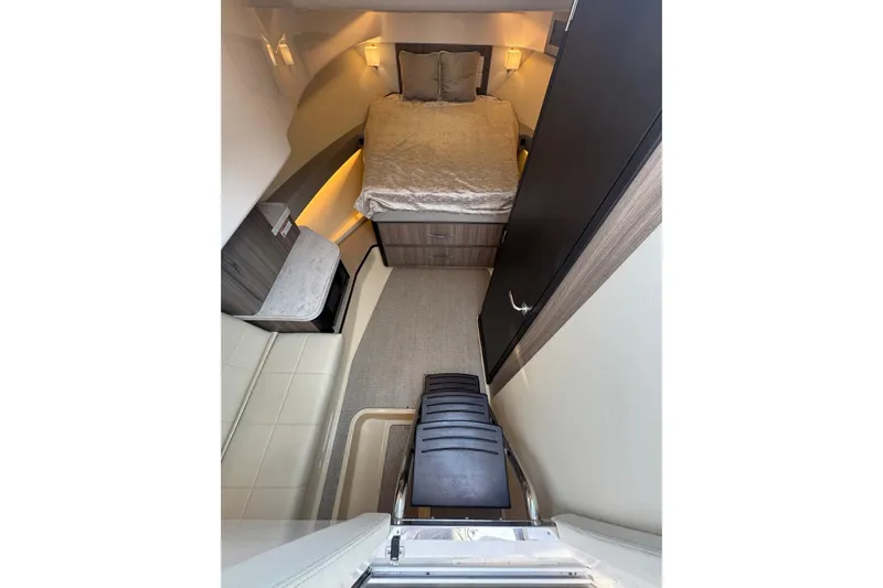  Yacht Photos Pics Interior cabin of 2021 Regal 36 Grande Coupe with bed and seating area.