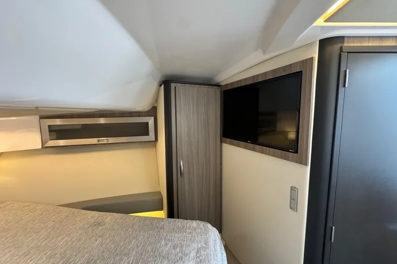  Yacht Photos Pics 2021 Regal 36 Grande Coupe interior with TV, cabinet, and modern design.