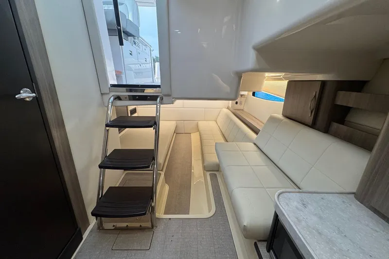  Yacht Photos Pics Interior of 2021 Regal 36 Grande Coupe with modern seating and compact design.