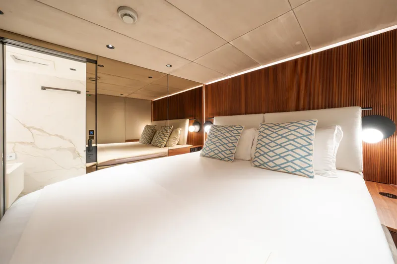  Yacht Photos Pics Luxurious bedroom interior of 2024 Sunreef 60 Eco yacht with modern design and elegant decor.