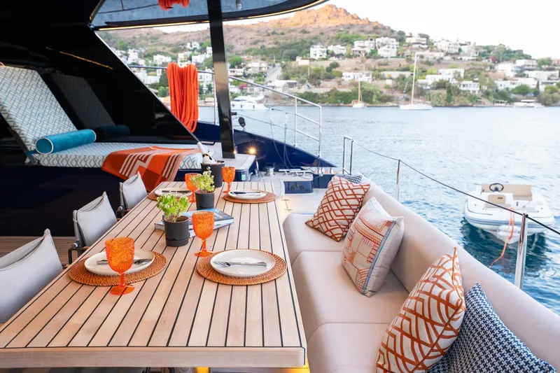  Yacht Photos Pics Luxurious Sunreef 60 Eco yacht deck with elegant dining setup, 2024 model.