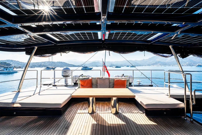  Yacht Photos Pics Luxurious 2024 Sunreef 60 Eco yacht deck with solar panels and scenic ocean view.
