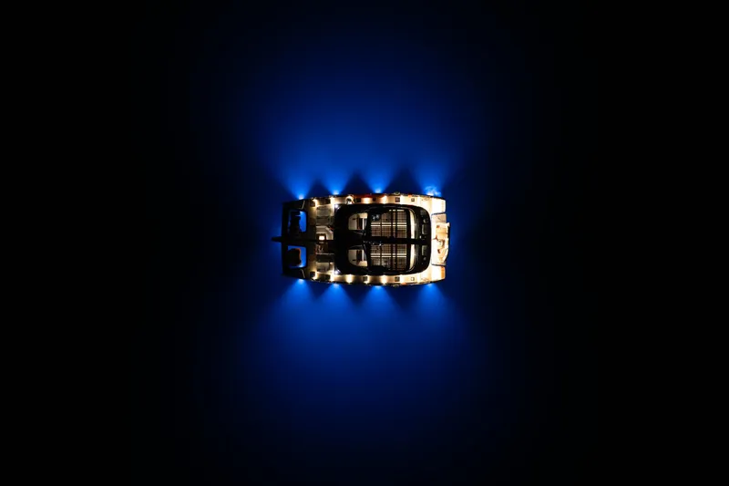  Yacht Photos Pics Aerial view of 2024 Sunreef 60 Eco yacht illuminated at night on dark water.