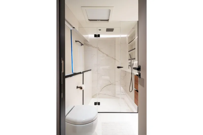  Yacht Photos Pics Luxurious bathroom in 2024 Sunreef 60 Eco yacht with modern shower and sleek design.