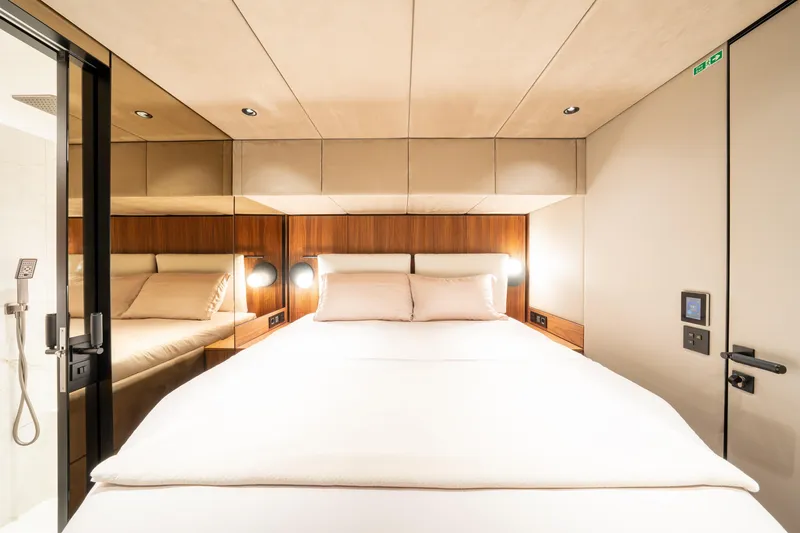  Yacht Photos Pics Luxurious cabin interior of 2024 Sunreef 60 Eco yacht with modern design and cozy bedding.