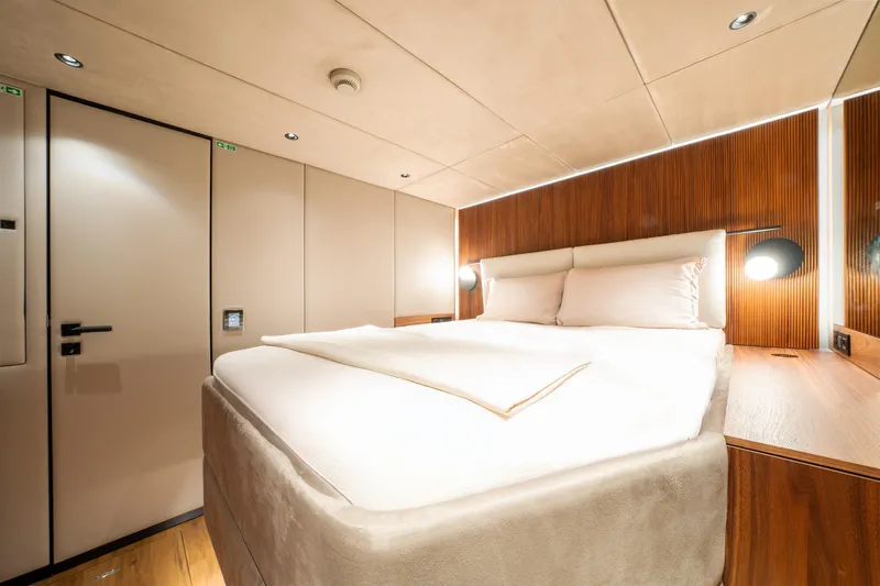  Yacht Photos Pics Luxurious bedroom interior of 2024 Sunreef 60 Eco yacht with modern design.