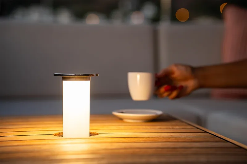  Yacht Photos Pics Elegant table lamp and coffee cup on Sunreef 60 Eco yacht, 2024 model.