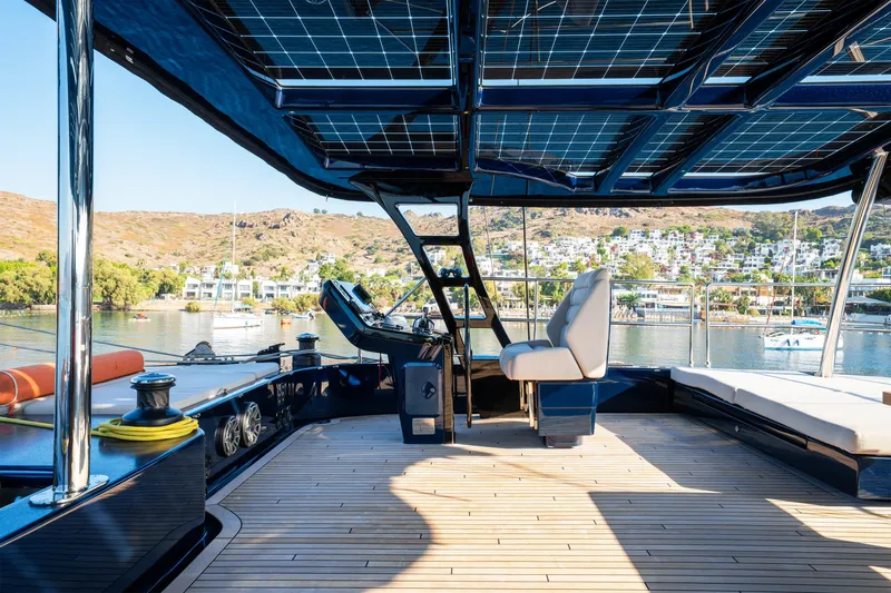  Yacht Photos Pics Luxurious Sunreef 60 Eco yacht interior with solar panels, 2024 model, docked in scenic marina.