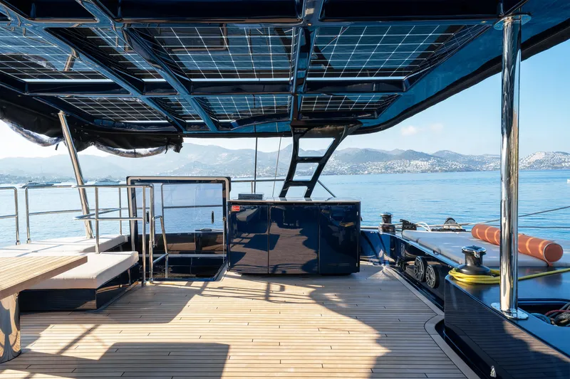  Yacht Photos Pics Luxurious 2024 Sunreef 60 Eco yacht deck with solar panels and scenic ocean view.