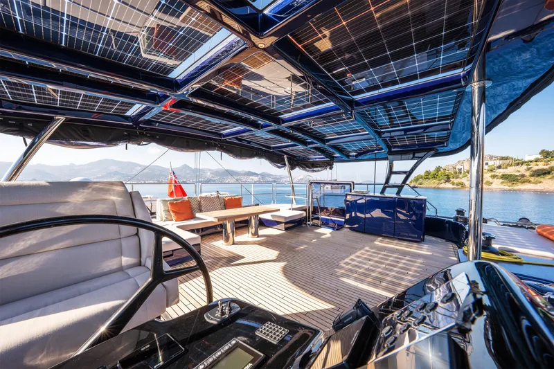  Yacht Photos Pics Luxurious Sunreef 60 Eco yacht interior with solar panels, spacious deck, and scenic ocean view.