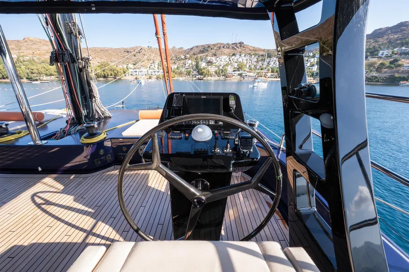  Yacht Photos Pics Helm of 2024 Sunreef 60 Eco yacht with scenic coastal view.