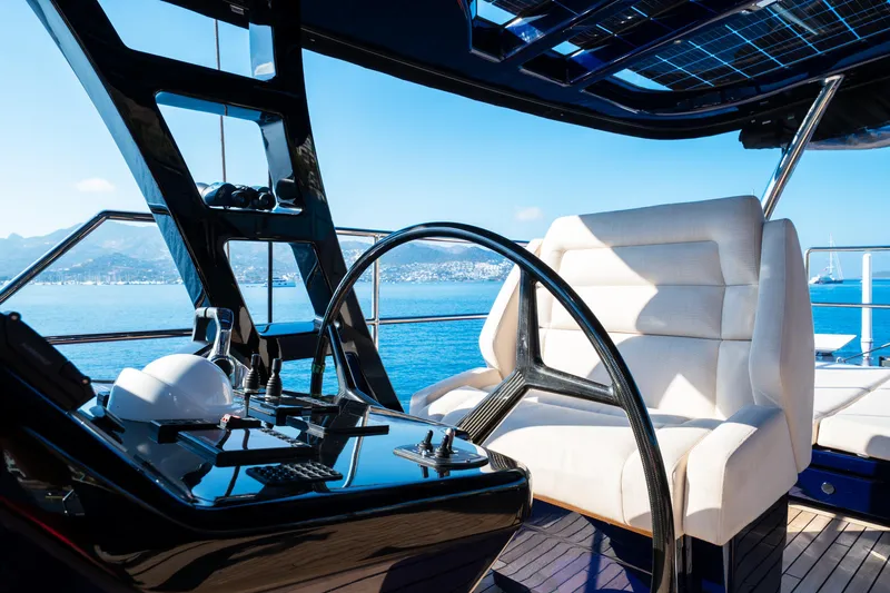  Yacht Photos Pics Luxurious helm of 2024 Sunreef 60 Eco yacht with modern controls and ocean view.