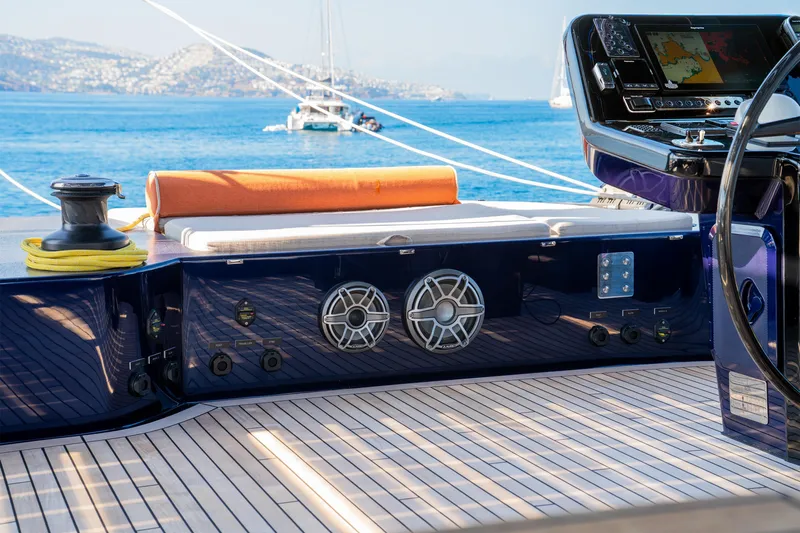  Yacht Photos Pics Luxurious Sunreef 60 Eco yacht deck with navigation controls, speakers, and ocean view, 2024 model.
