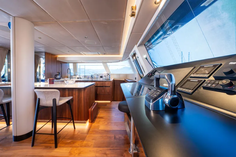  Yacht Photos Pics Luxurious interior of 2024 Sunreef 60 Eco yacht with modern kitchen and control panel.