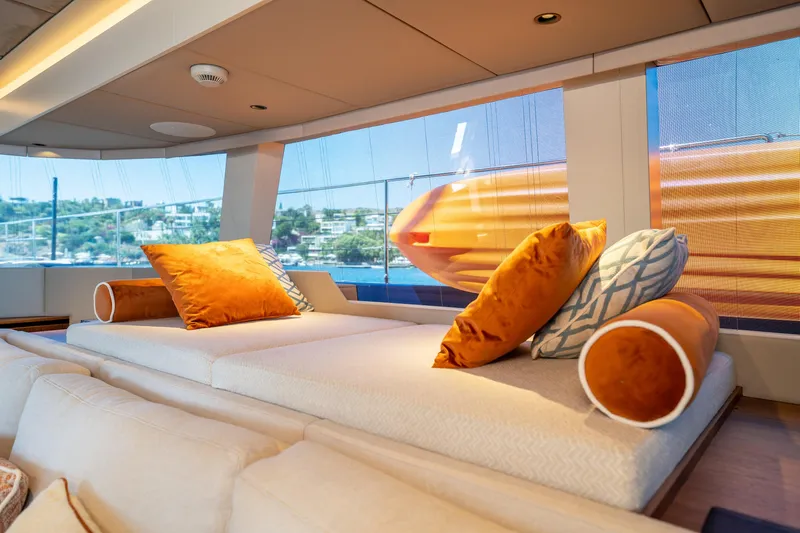  Yacht Photos Pics Luxurious interior of 2024 Sunreef 60 Eco yacht with plush orange cushions.