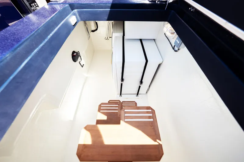  Yacht Photos Pics Interior view of 2024 Sunreef 60 Eco yacht, featuring sleek storage and wooden steps.